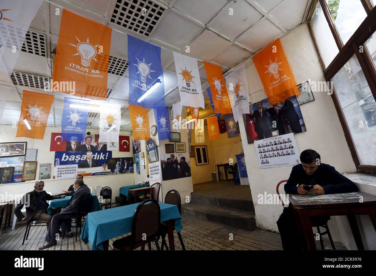 Men chat at a local election campaign office of the ruling AK Party in Istanbul, Turkey, October 30, 2015. Turkey holds its second general election of the year on Nov. 1, a snap vote which President Tayyip Erdogan hopes will see the ruling AK Party win back the majority it lost five months ago. REUTERS/Murad Sezer Stock Photo