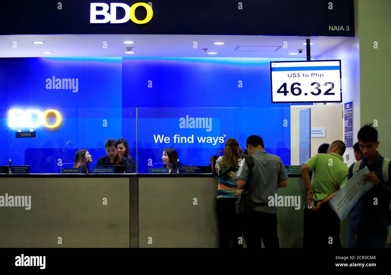 Tellers At The Philippines Banco De Oro Bdo Unibank Inc Process Transactions Inside The Ninoy Aquino International Airport Naia Terminal 3 At Pasay City Metro Manila Philippines June 20 2016 Reuters Romeo Ranoco