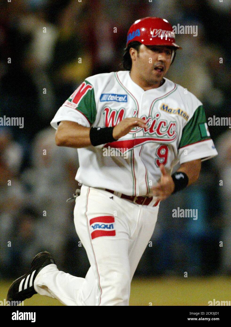 Mexican third base player Castilla of Los Venados de Mazatlan runs arounds  the bases after hitting a home run against Puerto Rico's Indios de Mayaguez  in Mazatlan, Mexico. Mexican third base player