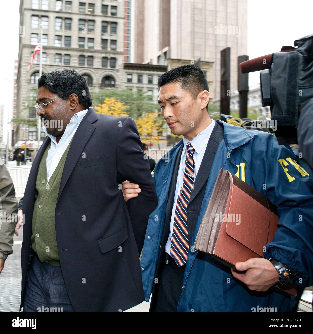 File Picture Shows Galleon Hedge Fund Partner Raj Rajaratnam L Is Escorted By Fbi Special Agent B J Kang R After Being Taken Into Custody In New York October 16 09 B J Kang File Picture Shows Galleon Hedge Fund Partner Raj Rajaratnam L Is Escorted By Fbi Special Agent B J Kang R After Being Taken Into Custody In New York October 16 09 B J Kang