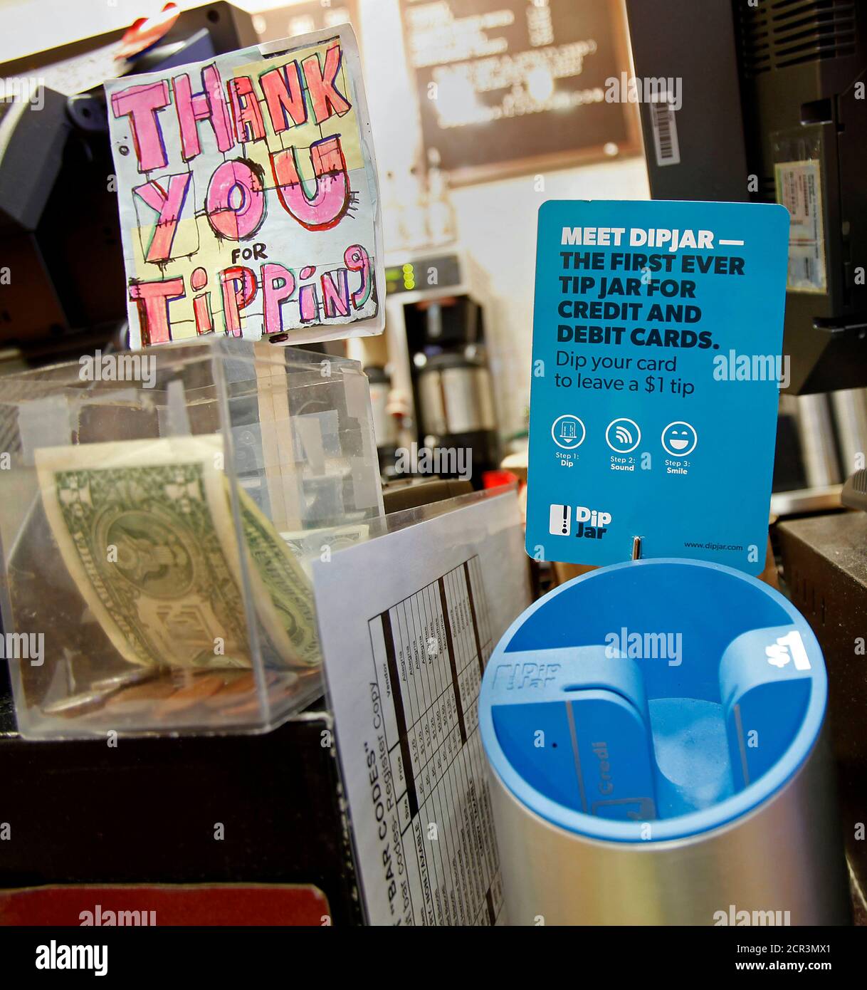 A Dipjar An Electronic Version Of The Tip Jar Found In Coffee Shops Is Seen On The Counter Of An Oren S Daily Roast In New York February 13 13 With A Quick