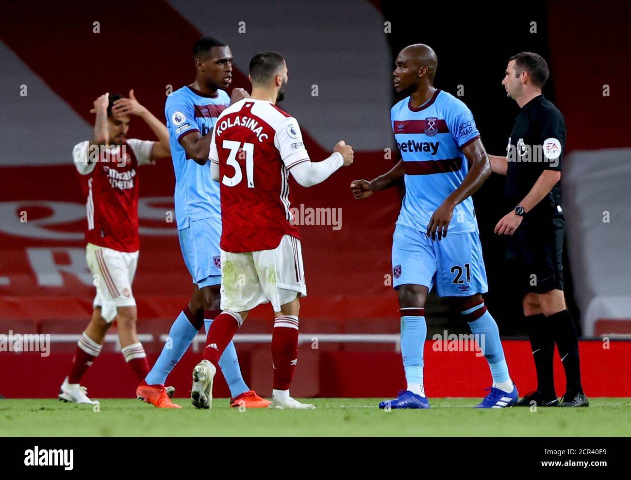 Arsenal's Sead Kolasinac (third left) fist bumps with West Ham United's ...
