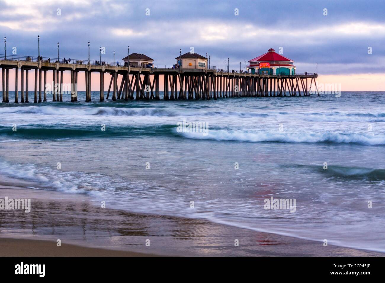 Seascape of the Huntington Beach pier at sunset, with slow shutter ...