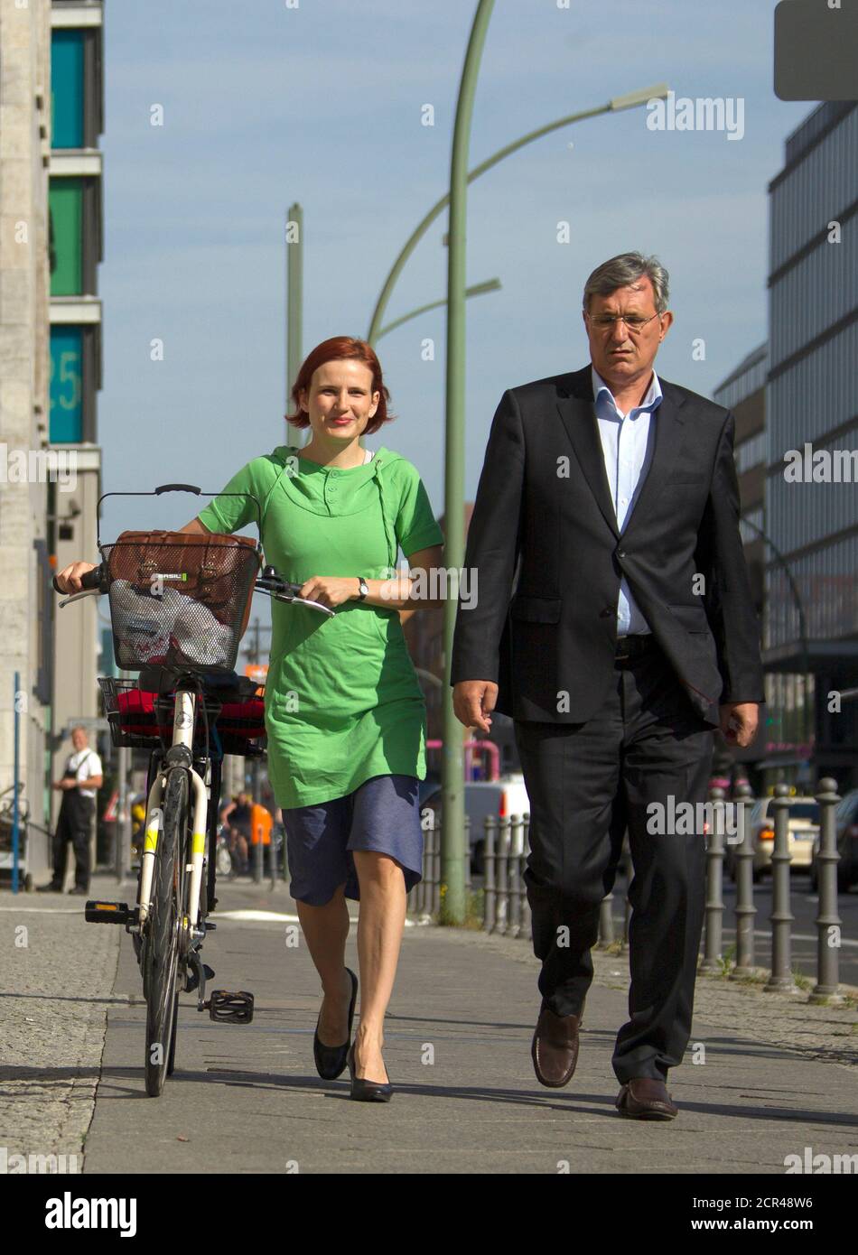 The leaders of the left-wing Die Linke party Katja Kipping (L) and Bernd Riexinger arrive at the finance ministry to meet the media in Berlin, August 16, 2012.  REUTERS/Thomas Peter (GERMANY - Tags: POLITICS BUSINESS) Stock Photo