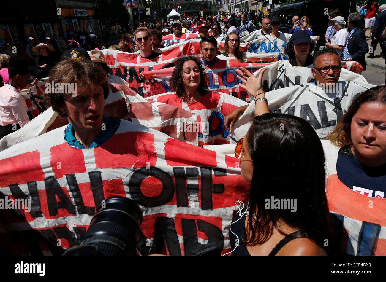 Demonstrators protesting against the immigration policies of Republican U.S. presidential nominee Donald Trump march outside the arena hosting the Republican National Convention in Cleveland, Ohio, U.S. July 19, 2016.         REUTERS/Lucas Jackson Stock Photo