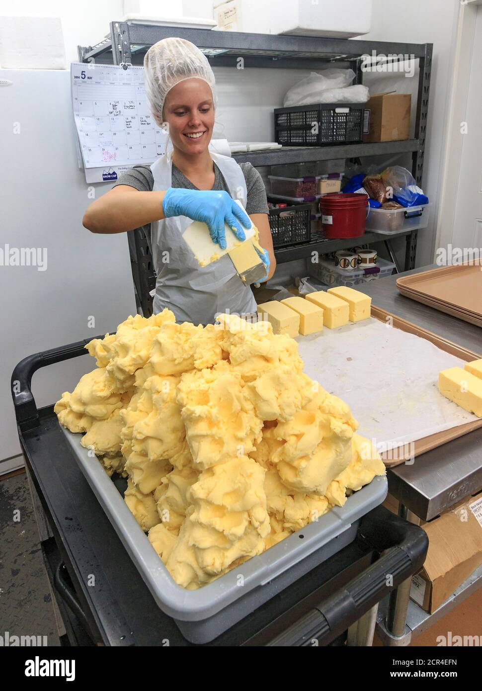 Packing butter into one-pound forms at Golden Ears Cheese Crafters, selling butter, cheese, baked goods and crafts. The dairy products are made on site using milk from the family own dairy cows. Located in Maple Ridge, British Columbia, Canada, south of Vancouver at the Canada-US border. Stock Photo