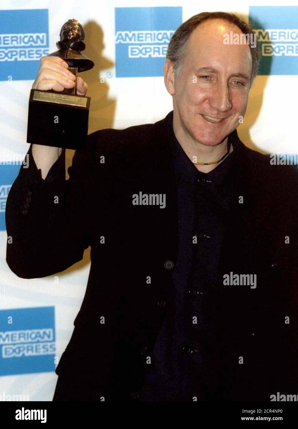 Pete Townshend, songwriter and lead guitarist for the band The Who, smiles as he poses with the