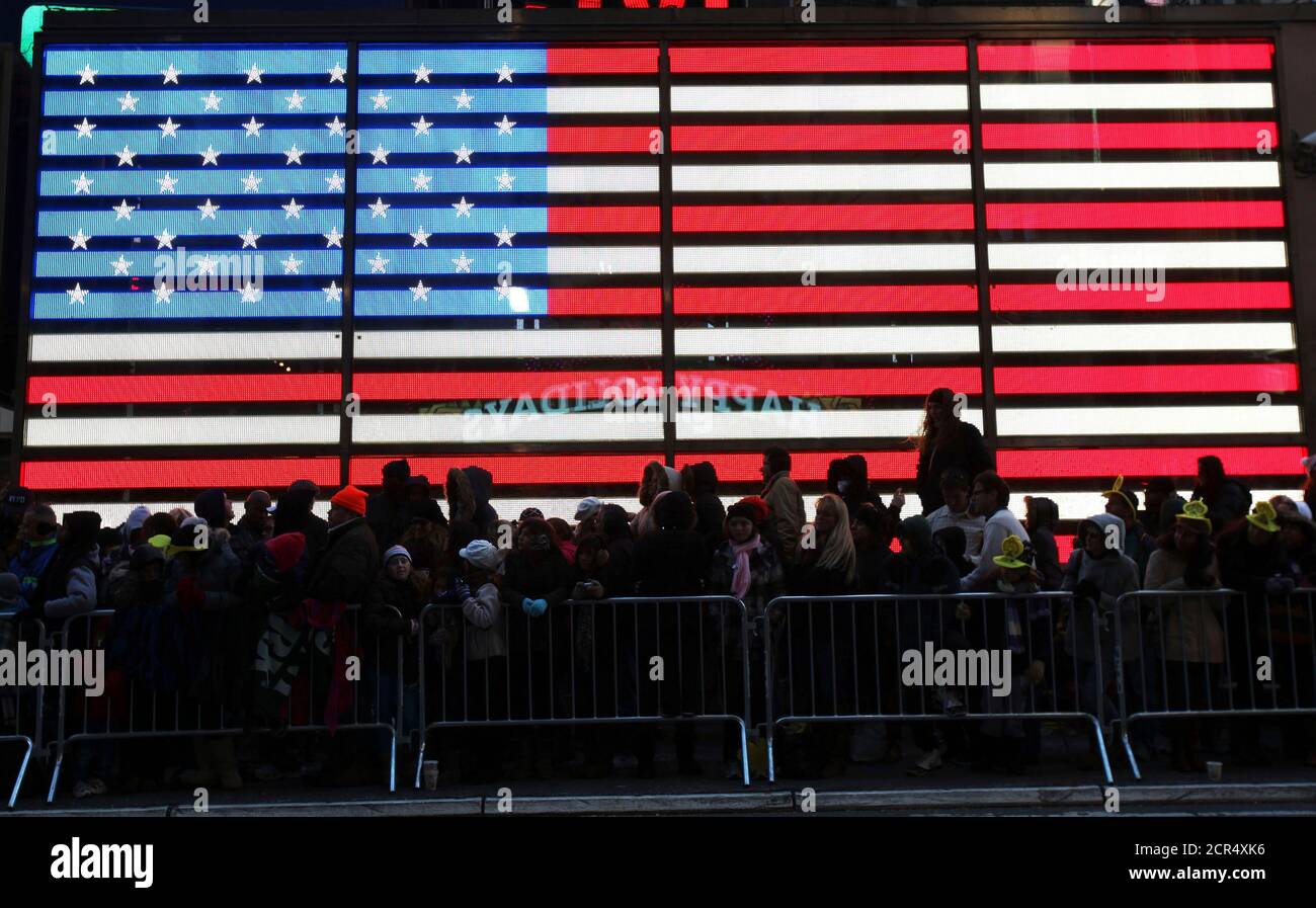 People watch as floats make their way through Times Square during the 85th annual Macy's Thanksgiving day parade in New York November 24, 2011. REUTERS/Shannon Stapleton (UNITED STATES - Tags: SOCIETY) Stock Photo