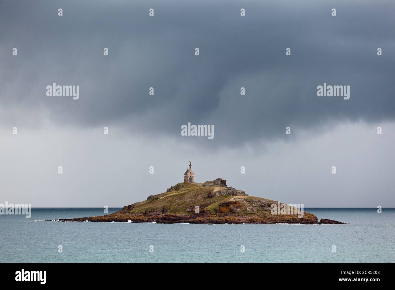 The tidal island of Ilot St. Michel at high tide during a summer thunderstorm Stock Photo
