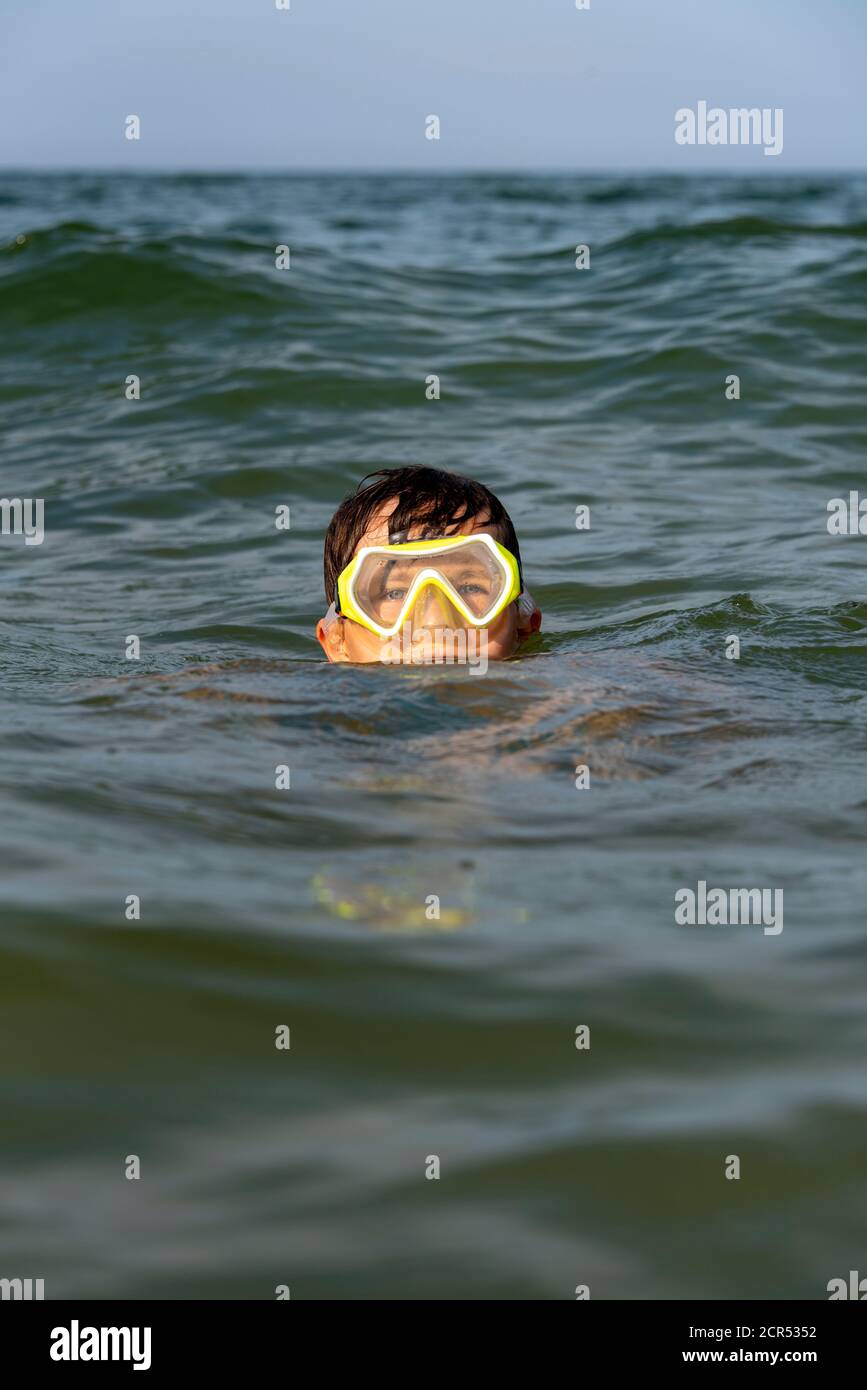 Germany, Mecklenburg-Western Pomerania, Ruegen Island, Baltic Sea resort Binz, boy with diving goggles, Baltic Sea Stock Photo
