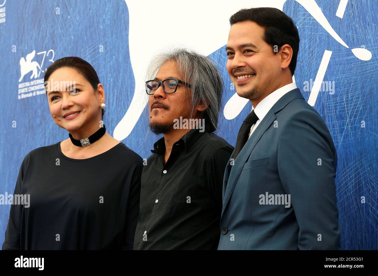 Director Lav Diaz (C) poses with actress Charo Santos-Concio (L) and actor John Lloyd Cruz (R) as they attend the photo call for the movie 'Ang Babaeng Humayo' (The Woman Who Left) at the 73rd Venice Film Festival in Venice, Italy September 9, 2016. REUTERS/Alessandro Bianchi Stock Photo
