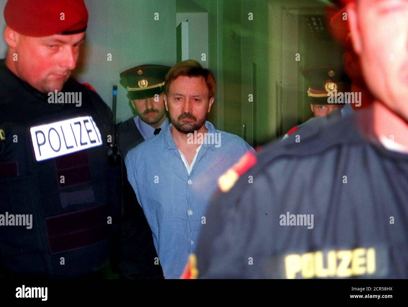 Franz Fuchs (C) is escorted by police 