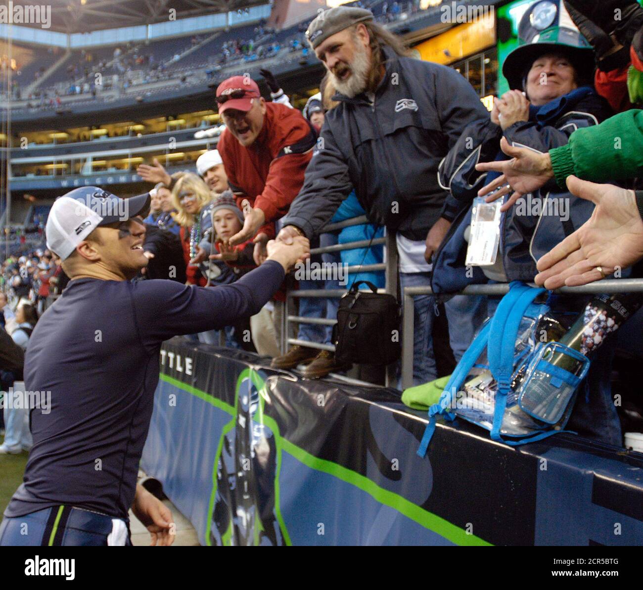 Seattle Seahawks quarterback Matt Hasselbeck shakes hands with fans following his team's win over the Atlanta Falcons 28-26, January 2, 2005, at Qwest Field in Seattle. It's the Seahawks first NFC West division title. REUTERS/Robert Sorbo  RSS Stock Photo