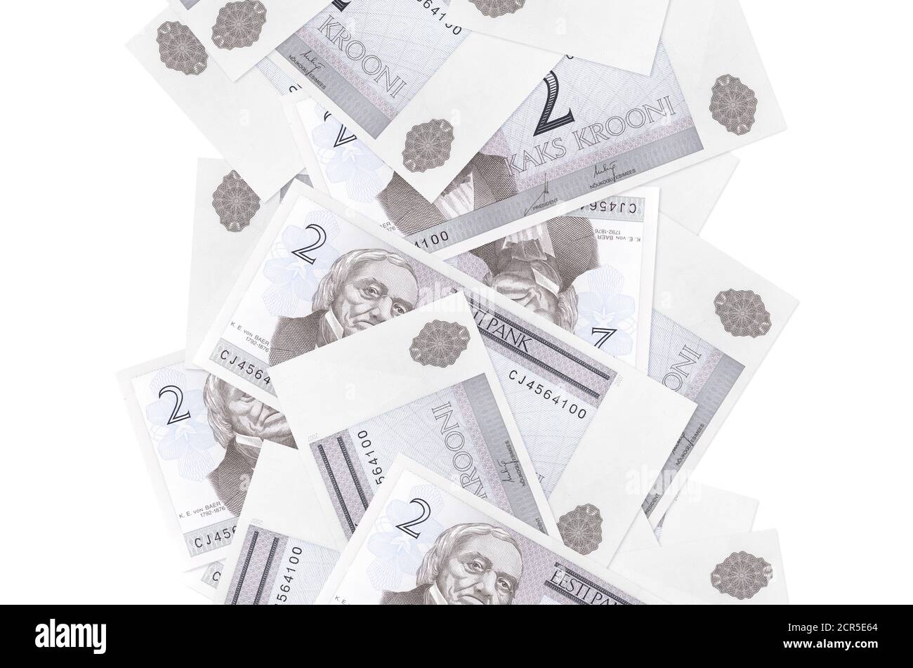 2 Estonian kroon bills flying down isolated on white. Many banknotes falling with white copy space on left and right side Stock Photo