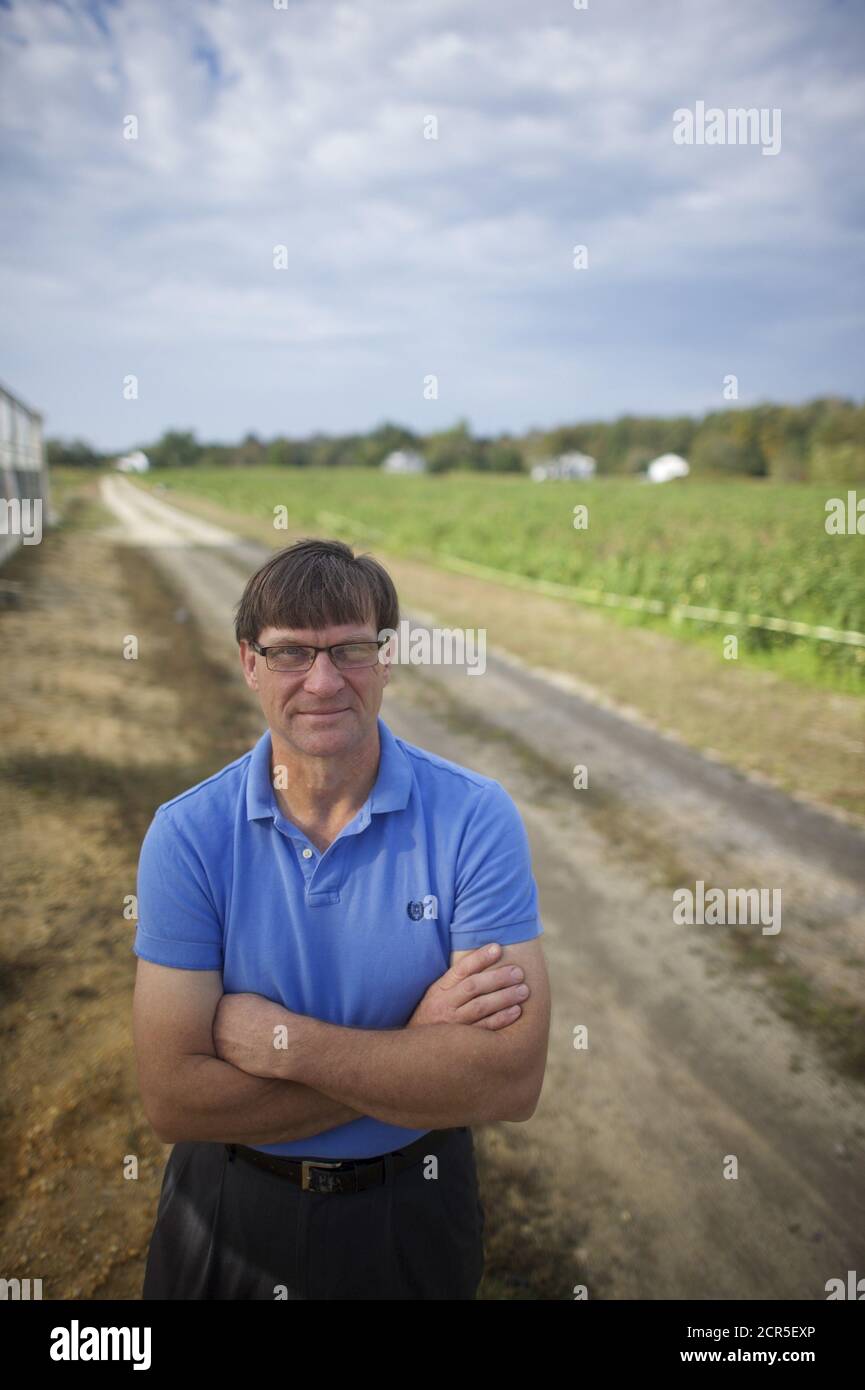 Richard VanVranken, 55, a Rutgers agricultural agent, visits the farm of Morris Gbolo, 57, in Vineland, New Jersey, October 9, 2015. New Jersey, officially nicknamed 'The Garden State' since 1954, is striving to revitalize its farming sector. It is seizing on trends such as the 'Eat Local' movement, agritourism and ethnic crops that appeal to a growing population of Asian, Hispanic and African residents, including those flocking to Gbolo's fields in Vineland. Picture taken October 9, 2015. To match Feature USA-AGRICULTURE/NEW JERSEY REUTERS/Mark Makela Stock Photo