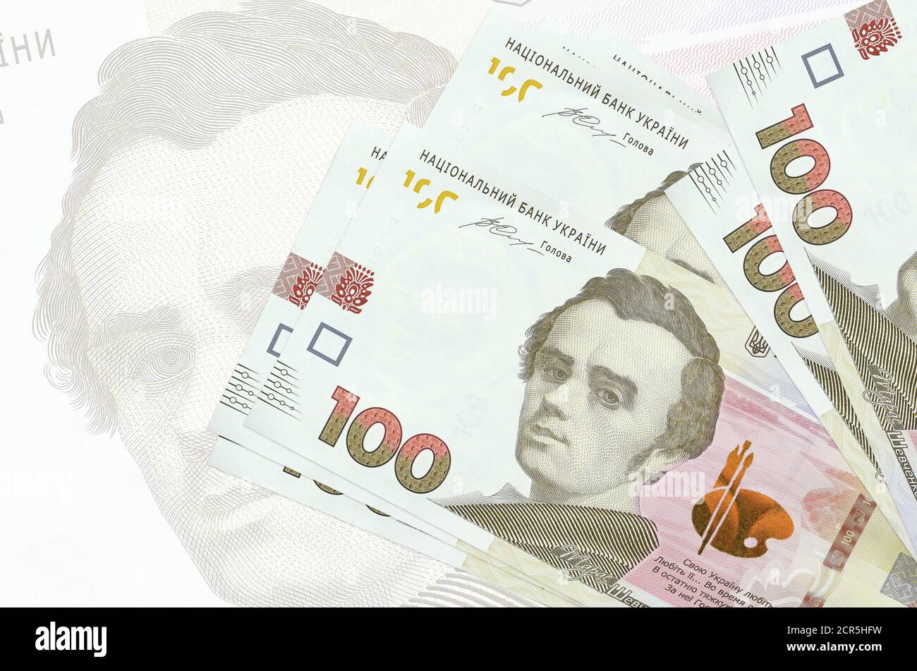 100 Ukrainian hryvnias bills lies in stack on background of big semi ...
