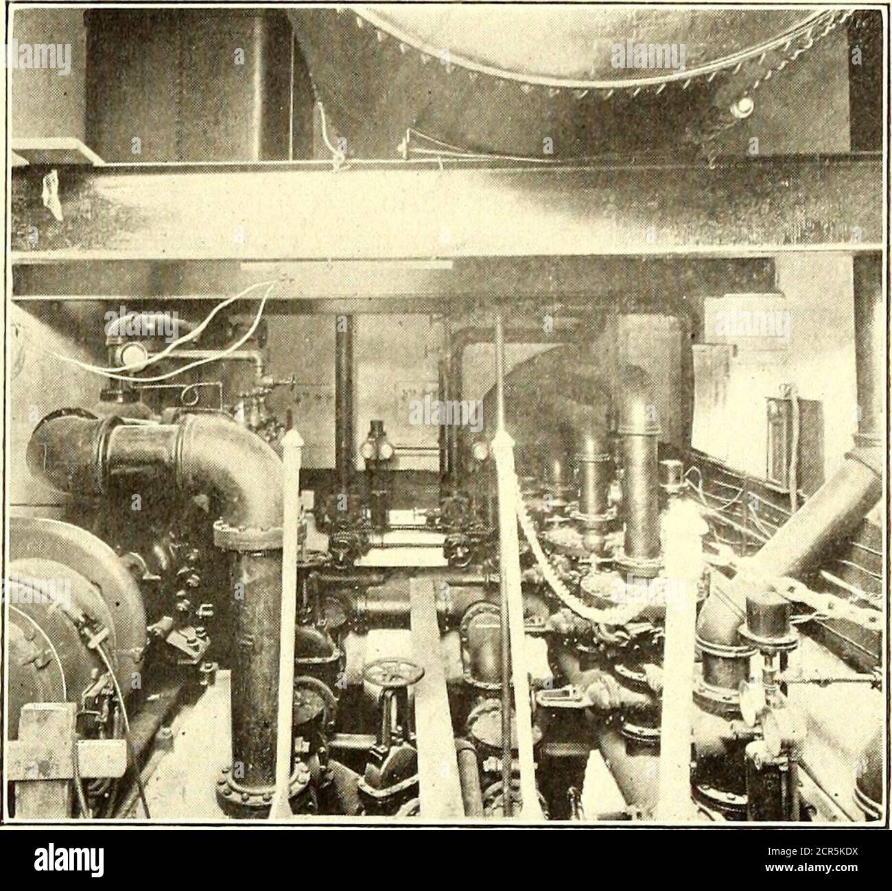 . Electric railway journal . Bridgeport Carhouse—Machine Shop Section on the First Floor hausters, one 150-lb. helve hammer, a combined punch andshear, and a babbitting furnace. The hammer and punchare driven by a shaft extended from the machine shop. The main machine shop has a 42-in. steel-tire wheel lathewith motor-operated tailstock, a 300-ton wheel press, a 200- boring mill, a double 12-in. emery grinder, a 30-in. automa-tic knife grinder and a magazine hack saw, all belt-drivenfrom a 15-hp motor. An overhead trolley rail carries a1-ton triplex hoist which serves the larger tools; in addi Stock Photo