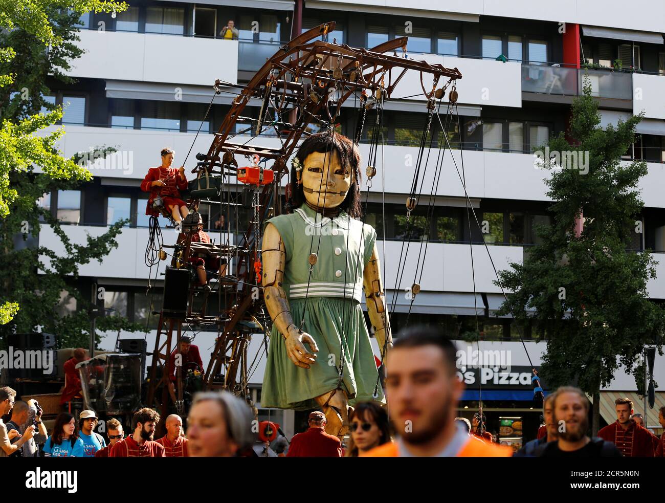 A Giant Animated Puppet Of A Girl Part Of A Performance By French Street Theatre Company
