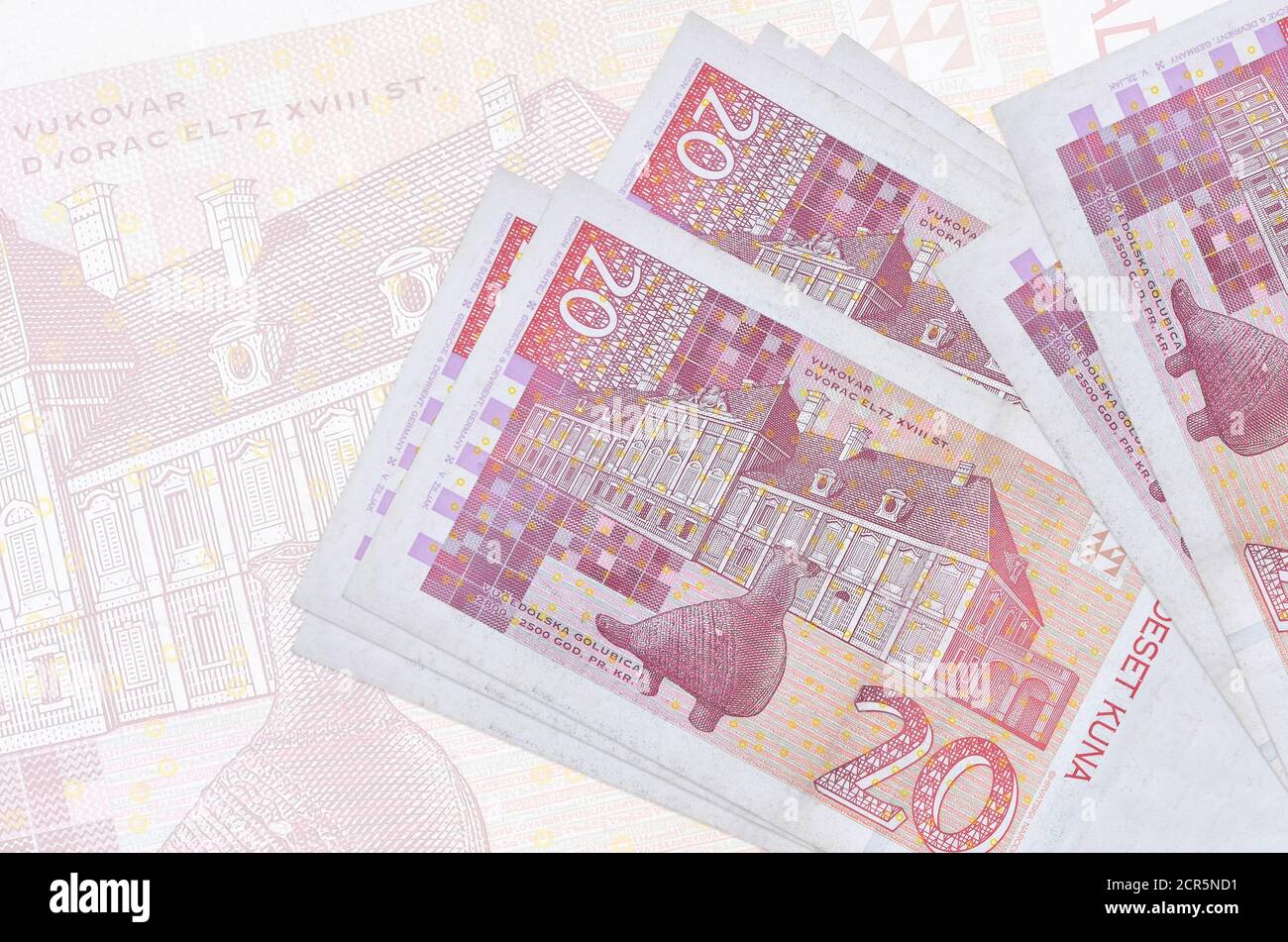 20 Croatian kuna bills lies in stack on background of big semi-transparent  banknote. Abstract presentation of national currency. Business concept  Stock Photo - Alamy