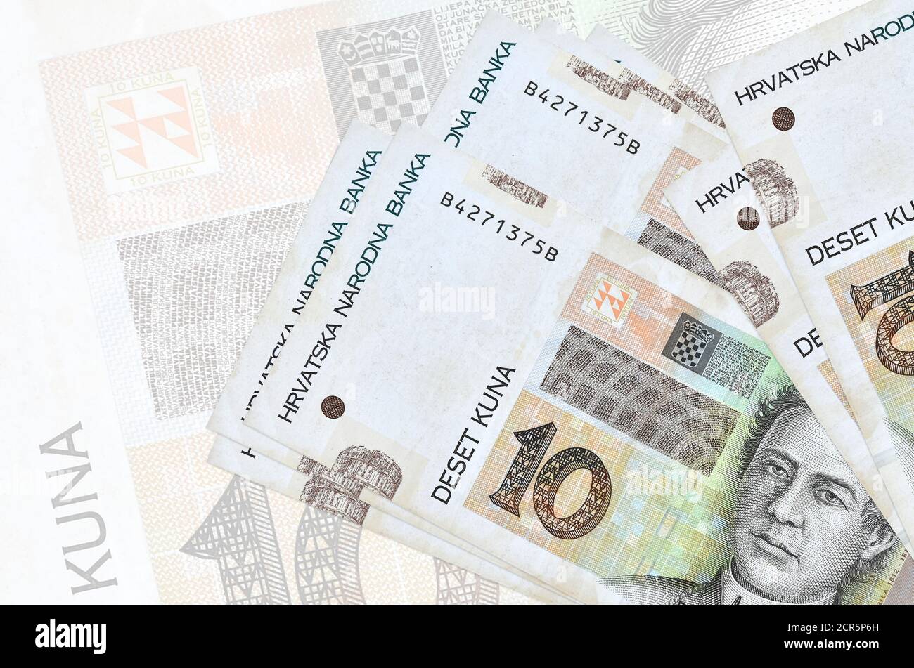 10 Croatian kuna bills lies in stack on background of big semi-transparent  banknote. Abstract presentation of national currency. Business concept  Stock Photo - Alamy