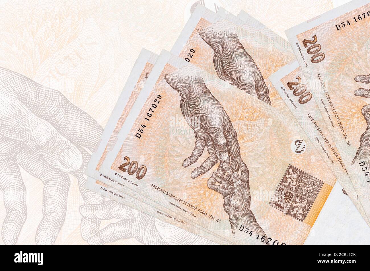 200 Czech korun bills lies in stack on background of big semi ...