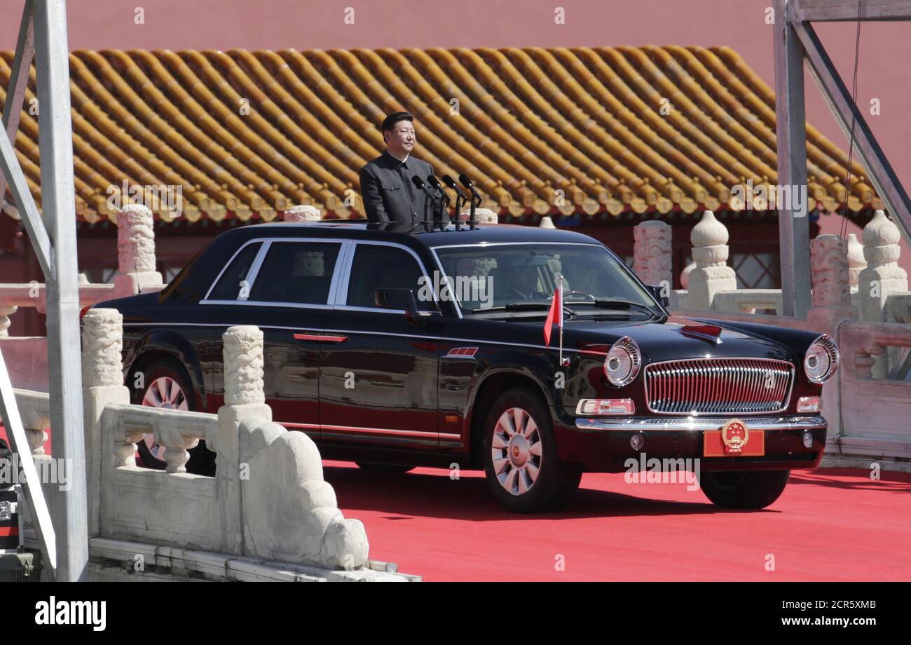 China's President Xi Jinping stands in a car as he inspects troops at a military parade to mark the 70th anniversary of the end of World War Two in Beijing, China, September 3, 2015.  REUTERS/Jason Lee Stock Photo
