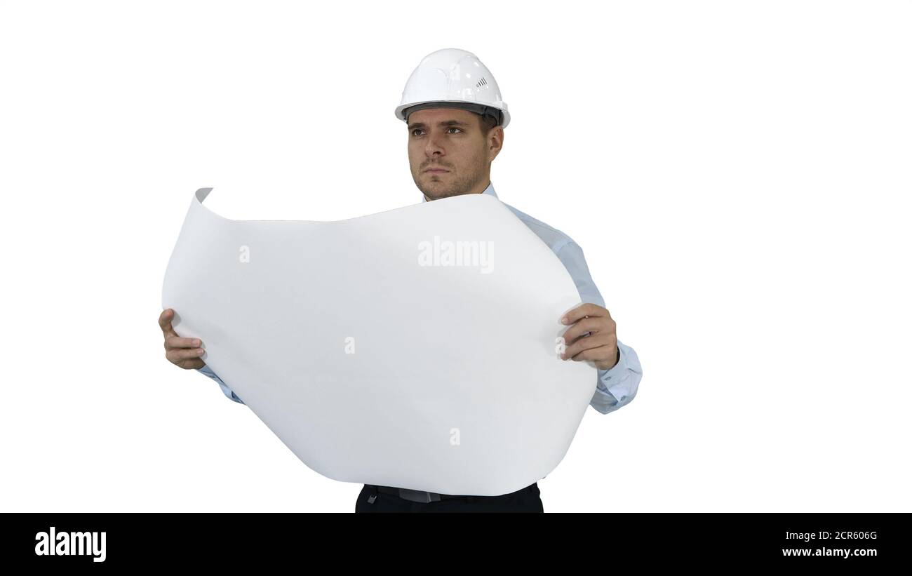 Engineer checking construction plan with what is built on white ...