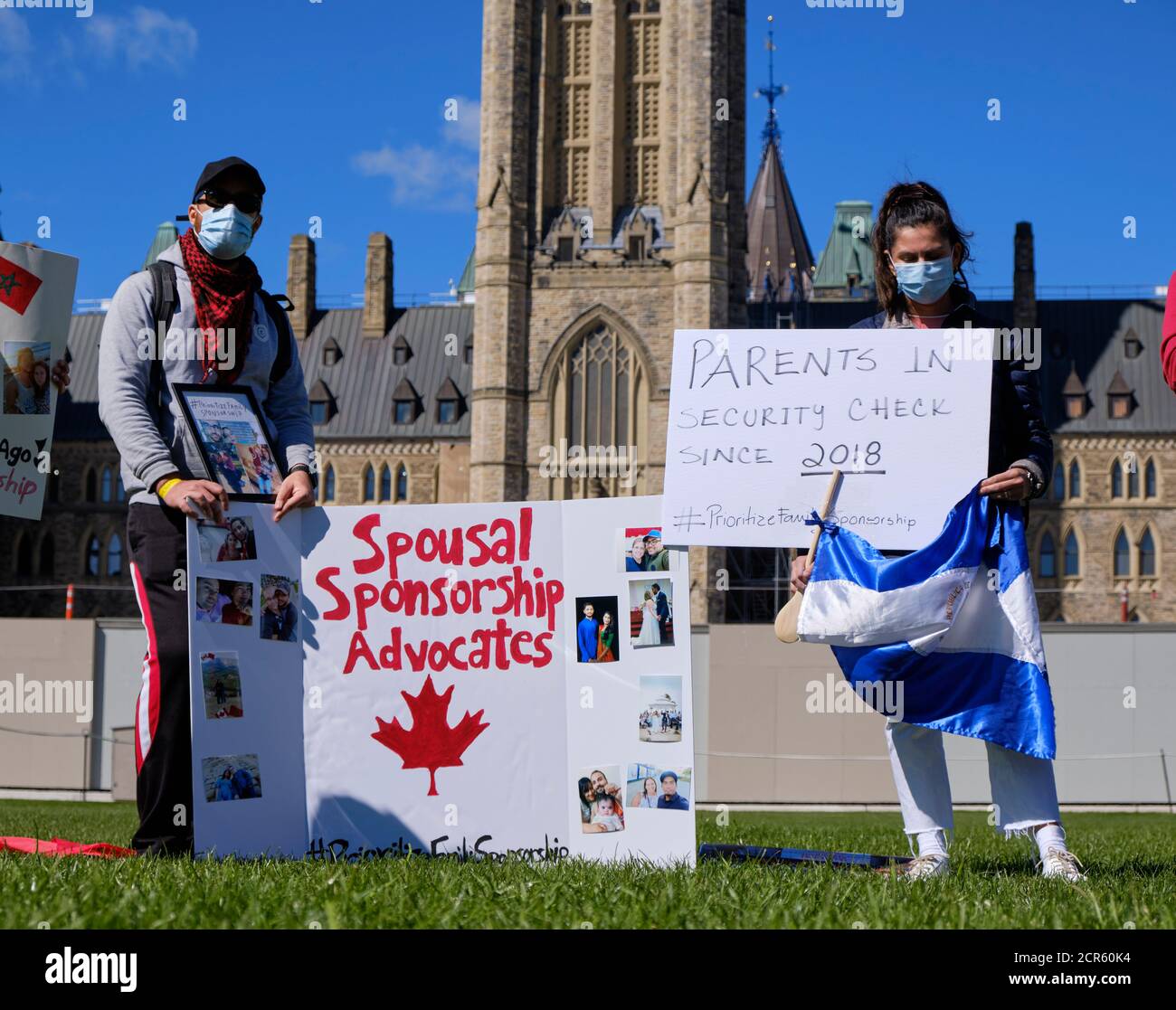 Protest demanding Canadian government Prioritize Family sponsorship, as binational couple are separated during Pandemic, and long delays. Stock Photo