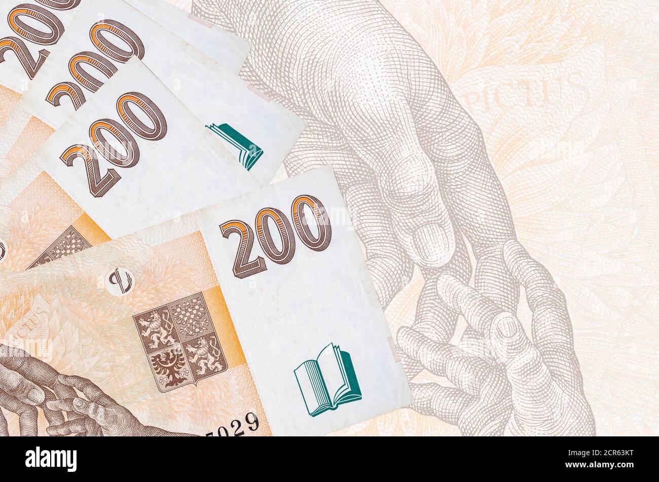 200 Czech korun bills lies in stack on background of big semi ...