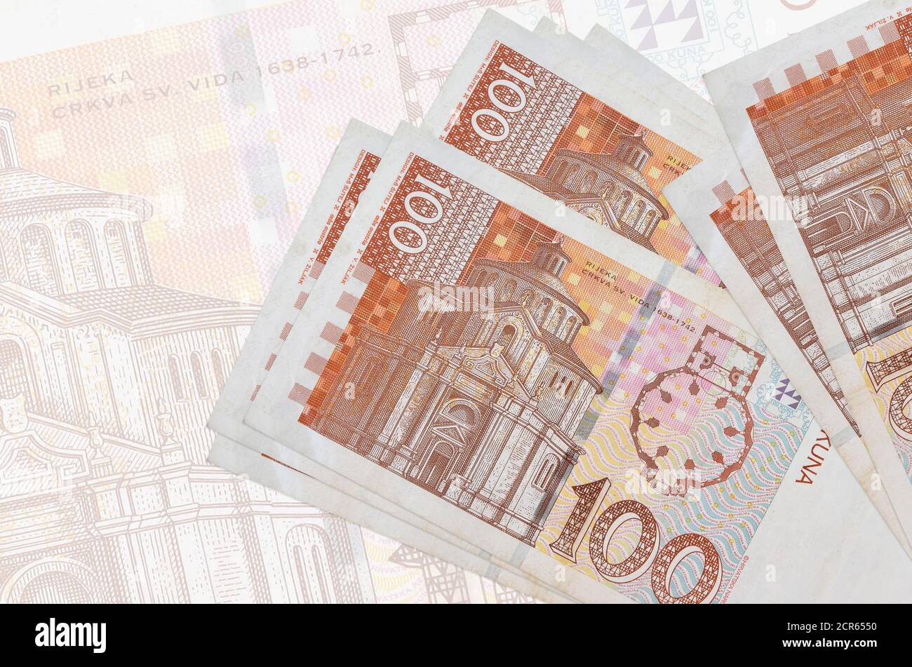 100 Croatian kuna bills lies in stack on background of big semi