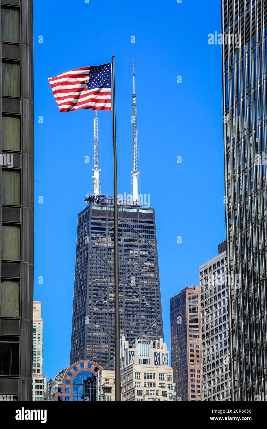 American flag in front of the John Hancock Center, Chicago, Illinois, USA, North America Stock Photo
