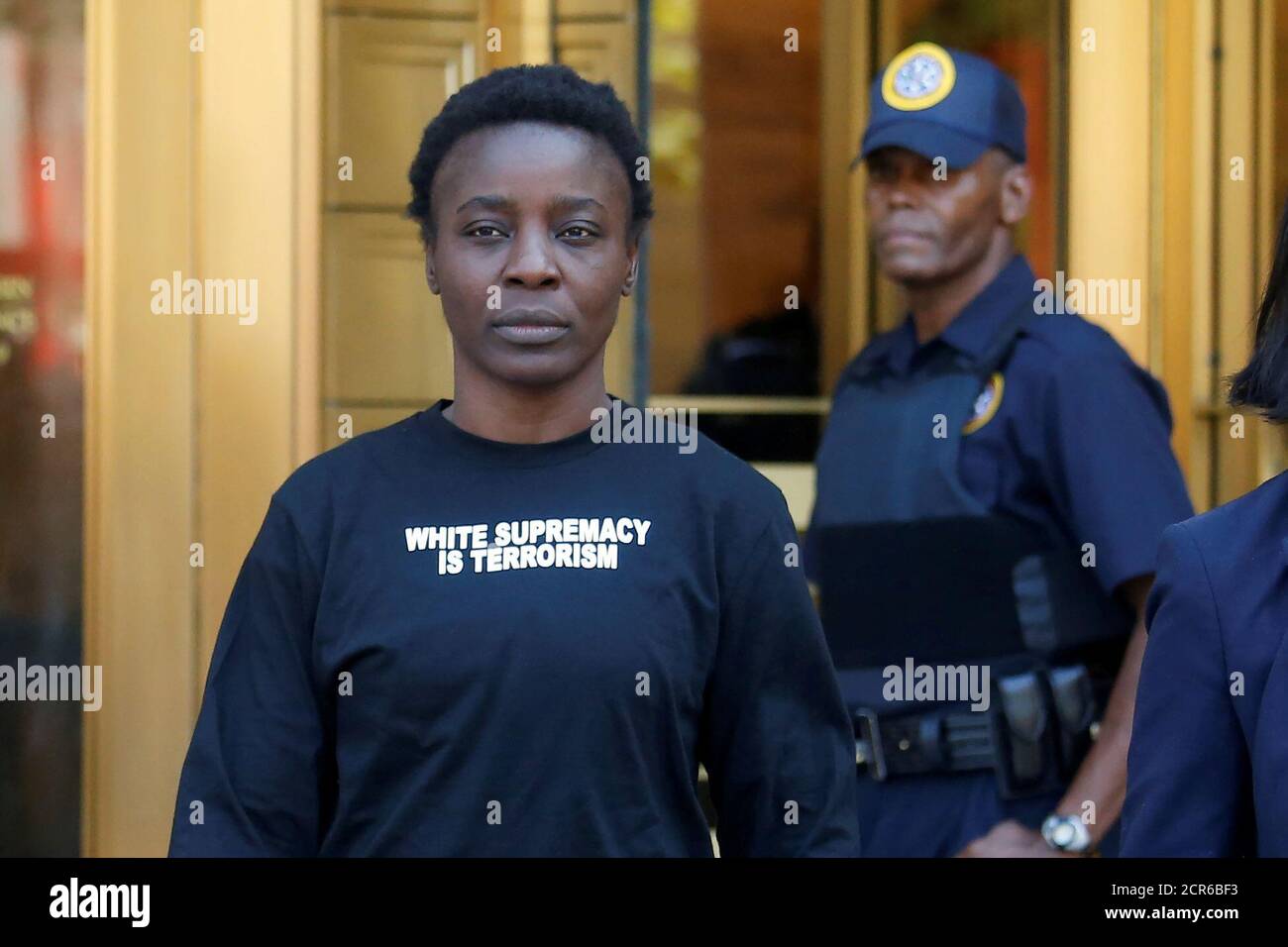 Patricia Okoumou walks out of federal court from her arraignment, a day after authorities say she scaled the stone pedestal of the Statue of Liberty to protest U.S. immigration policy, in Manhattan, New York, U.S., July 5, 2018. REUTERS/Shannon Stapleton Stock Photo
