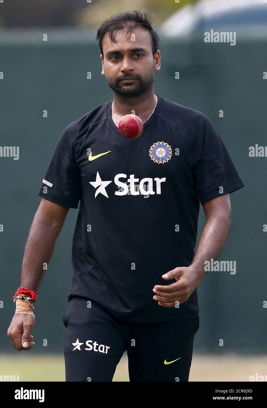 India's Amit Mishra tosses the ball during a practice session ahead of their third and final test cricket match against Sri Lanka in Colombo August 27, 2015. REUTERS/Dinuka Liyanawatte Stock Photo