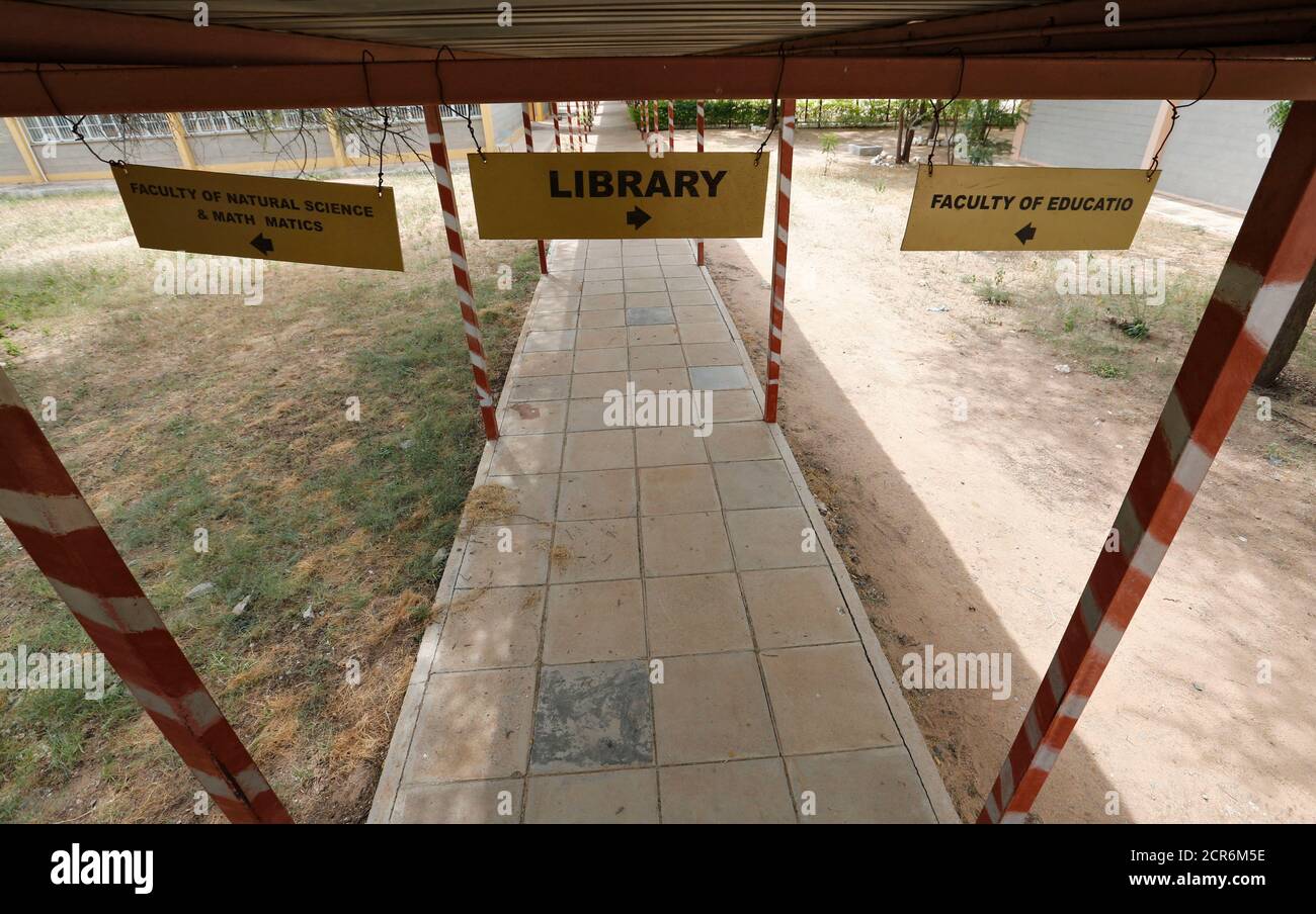 Directional signage hangs at the Garissa University College as students return to the campus in Kenya's northeast town of Garissa, January 11, 2016. The campus reopened today nine months after an attack by Somalia-based al-Qaeda linked al-Shabaab Islamist militants. REUTERS/Thomas Mukoya Stock Photo