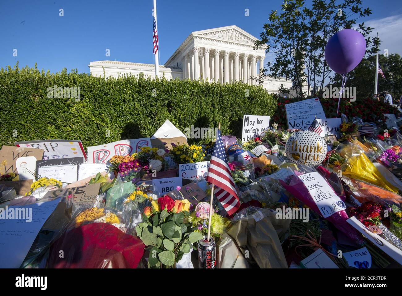 Washington, United States. 19th Sep, 2020. Flowers adorn the sidewalk as people pay their respects for Supreme Court Justice Ruth Bader Ginsburg in front of the United States Supreme Court in Washington, DC on Saturday, September 19, 2020. Ginsburg died at 87 after a battle with pancreatic cancer. Photo by Pat Benic/UPI Credit: UPI/Alamy Live News Stock Photo