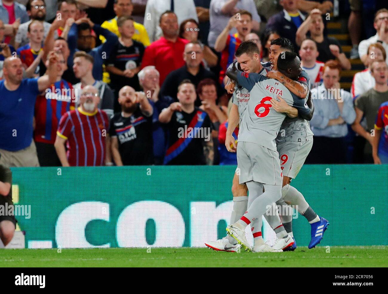 Soccer Football - Premier League - Crystal Palace v Liverpool - Selhurst Park, London, Britain - August 20, 2018  Liverpool's James Milner celebrates scoring their first goal from the penalty spot with Naby Keita and Roberto Firmino                   REUTERS/Eddie Keogh  EDITORIAL USE ONLY. No use with unauthorized audio, video, data, fixture lists, club/league logos or "live" services. Online in-match use limited to 75 images, no video emulation. No use in betting, games or single club/league/player publications.  Please contact your account representative for further details. Stock Photo