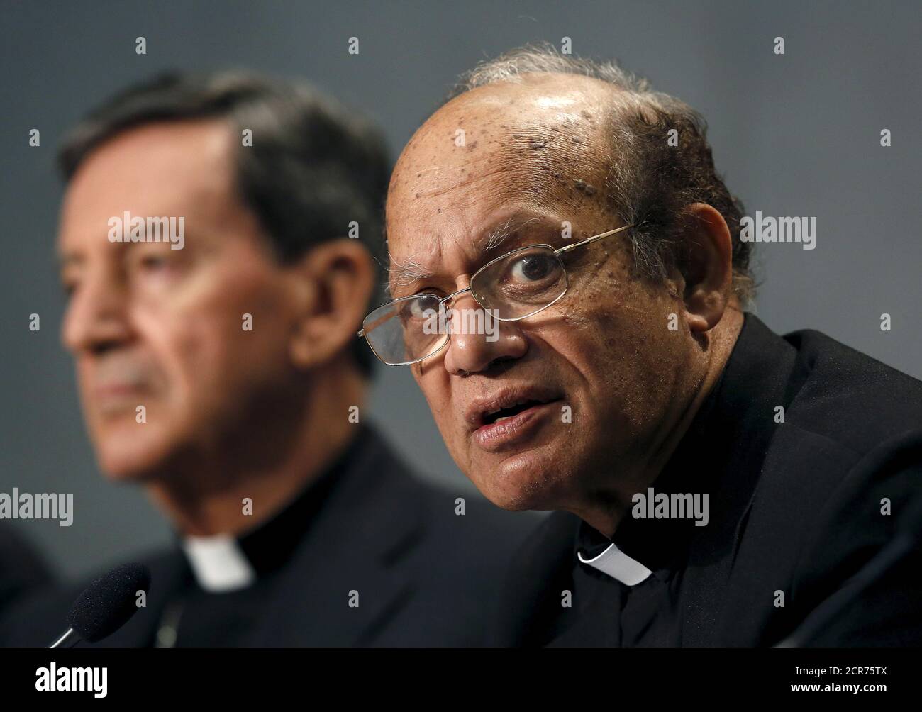 Cardinal Oswald Gracias (R) speaks next to Cardinal Ruben Salazar Gomez during a news conference at the Vatican, October 26, 2015. Roman Catholic leaders from around the world on Monday made a joint appeal to a forthcoming United Nations conference on climate change to produce a 'fair, legally binding and truly transformational' agreement.REUTERS/Alessandro Bianchi Stock Photo