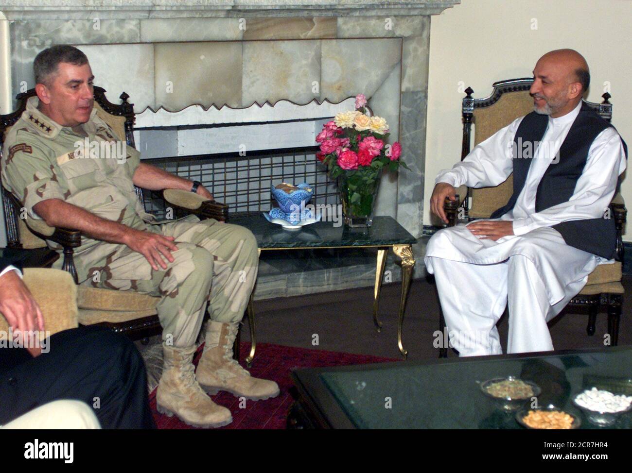 General John Abizaid (L), Commander, U.S. Central Command, meets Afghan President Hamid Karzai in Kabul on July 24, 2003. The United States said on Thursday it had sent B-52 and Harrier strike aircraft to bomb guerrillas who rocketed a base in eastern Afghanistan, while U.S. airborne and Italian mountain troops and more than 1,000 Afghan soldiers took part in major operation seeking to engage militants in the southeast. REUTERS/Ahmad Masood  AM/RCS Stock Photo