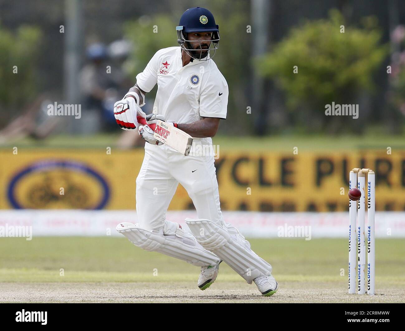 India's Shikhar Dhawan plays a shot during the second day of their first test cricket match against Sri Lanka in Galle, August 13, 2015. REUTERS/Dinuka Liyanawatte Stock Photo