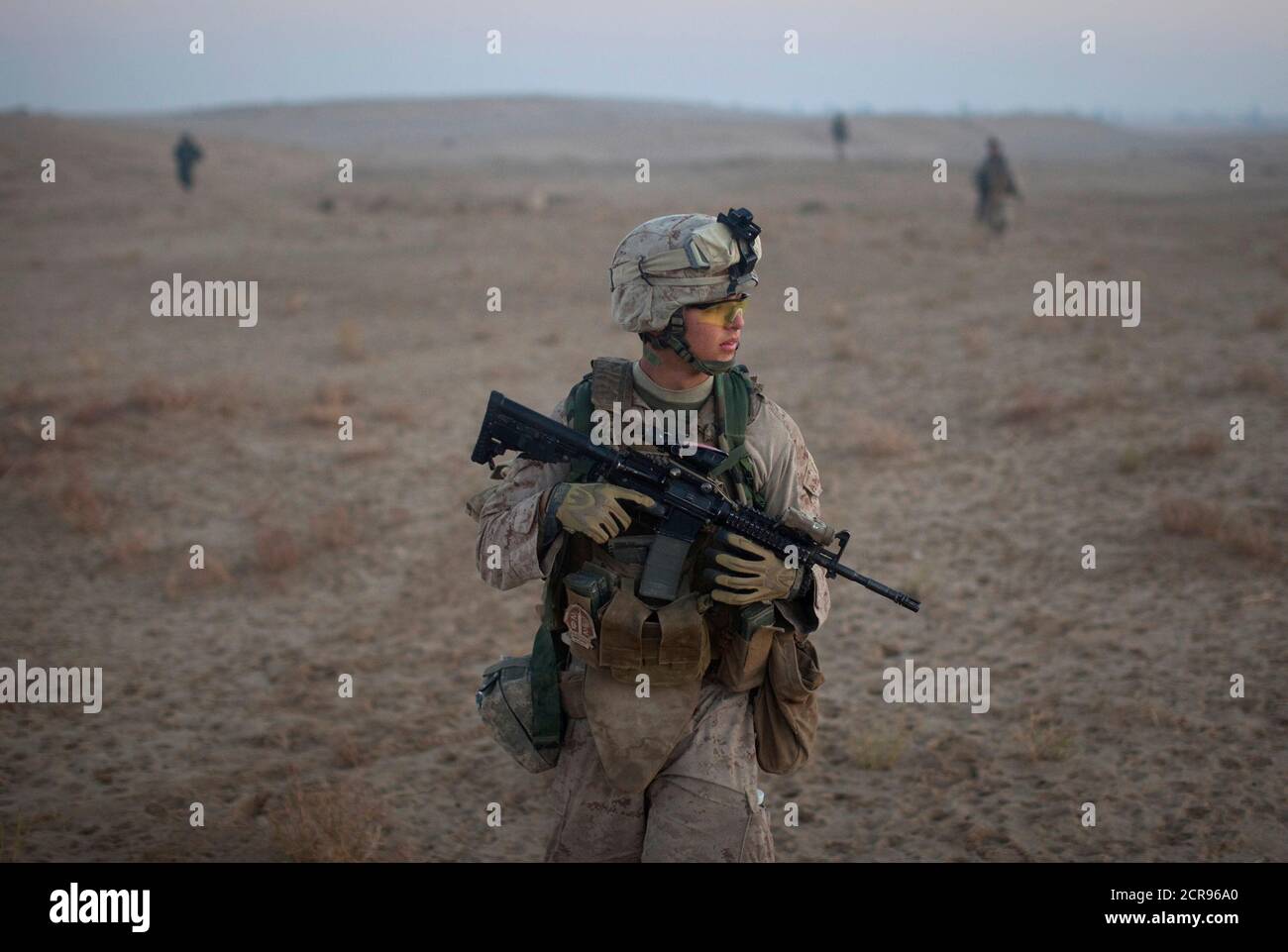 A U.S. Marine attached to the 2nd Battalion 2nd Marines from Camp Lejeune, North Carolina, takes part in an operation in the Garmsir district of Helmand Province December 23, 2009.   REUTERS/Adrees Latif   (AFGHANISTAN - Tags: POLITICS MILITARY) Stock Photo