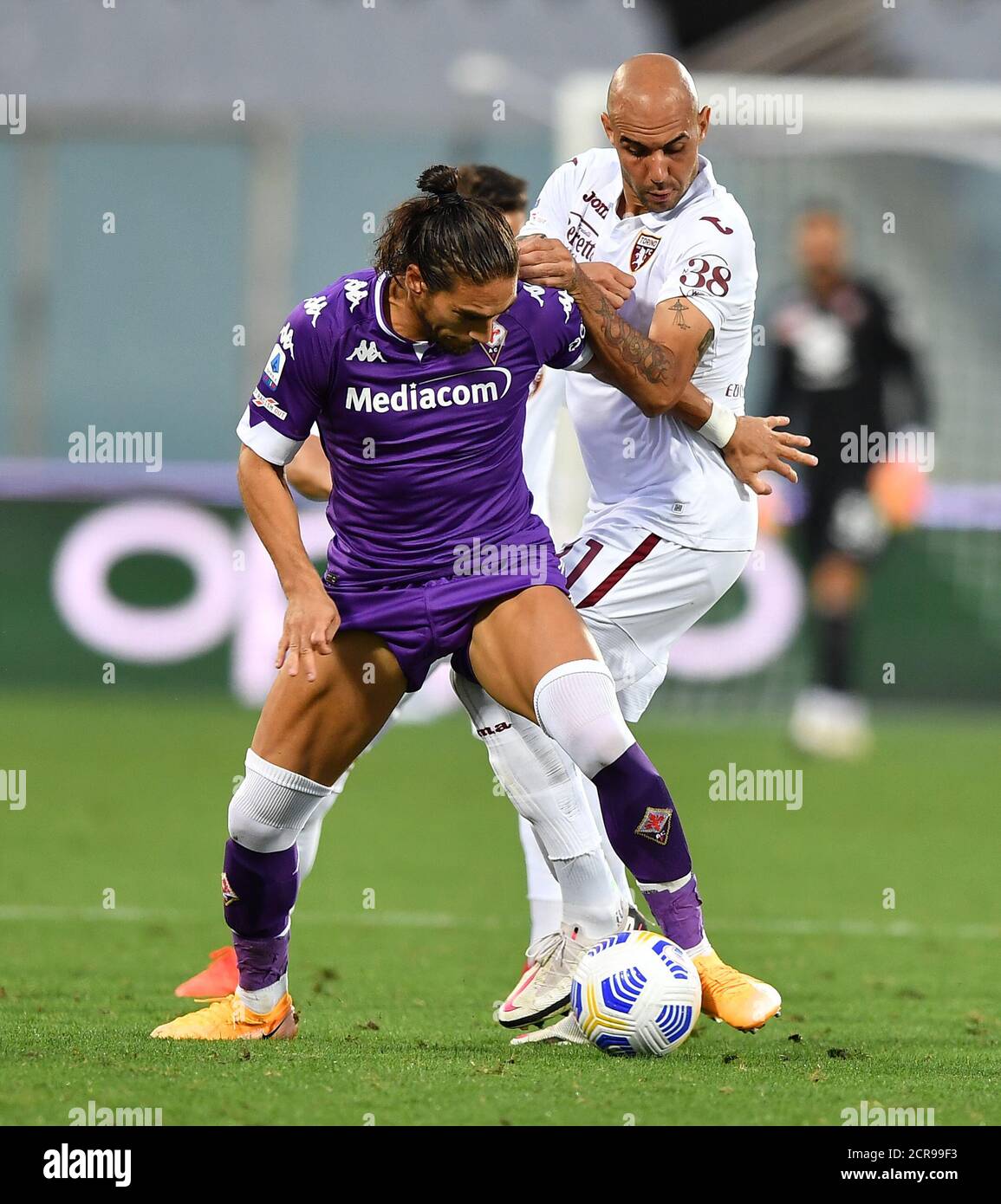 (200920) -- FLORENCE, Sept. 20, 2020 (Xinhua) Fiorentina's Martin Caceres (L) vies with Torino's Simone Zaza during a Serie A soccer match between Fiorentina and Torino in Florence, Italy, Sept. 19, 2020. (Xinhua) Stock Photo