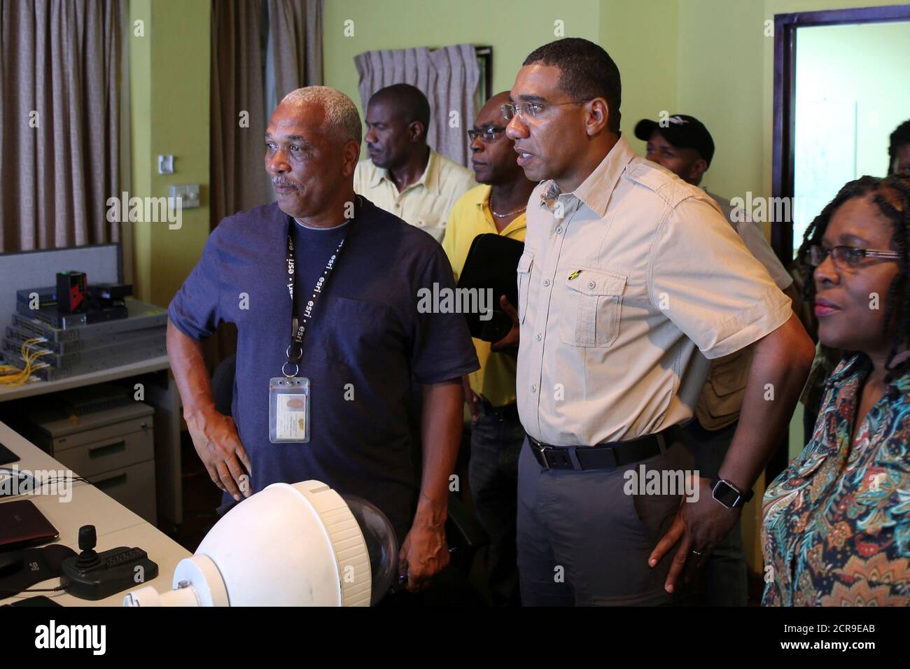 Jamaica's Prime Minister Andrew Holness meets with Michael Saunderson, Operations Manager of the National Works Agency, as Jamaicans brace on Saturday for the arrival of Hurricane Matthew in Kingston, Jamaica, October 1, 2016. REUTERS/Gilbert Bellamy Stock Photo