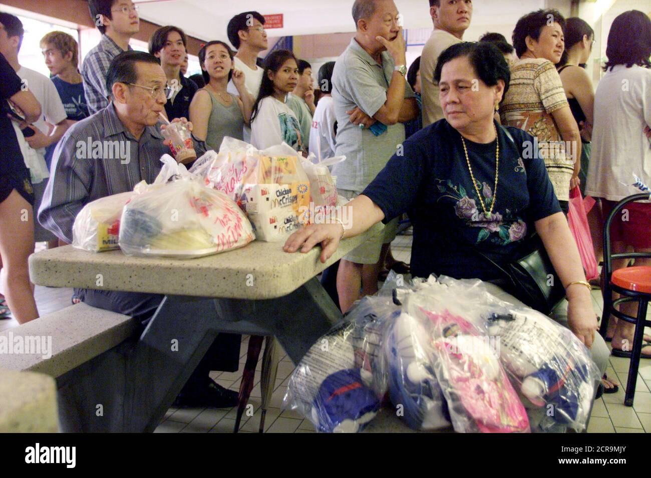 Singaporean Ng Geok Eng Takes A Break After Spending More Than Six Hours Lining Up For Hello Kitty And Partner Dear Daniel Dolls At A Mcdonalds Restaurant In Singapore January 13 She