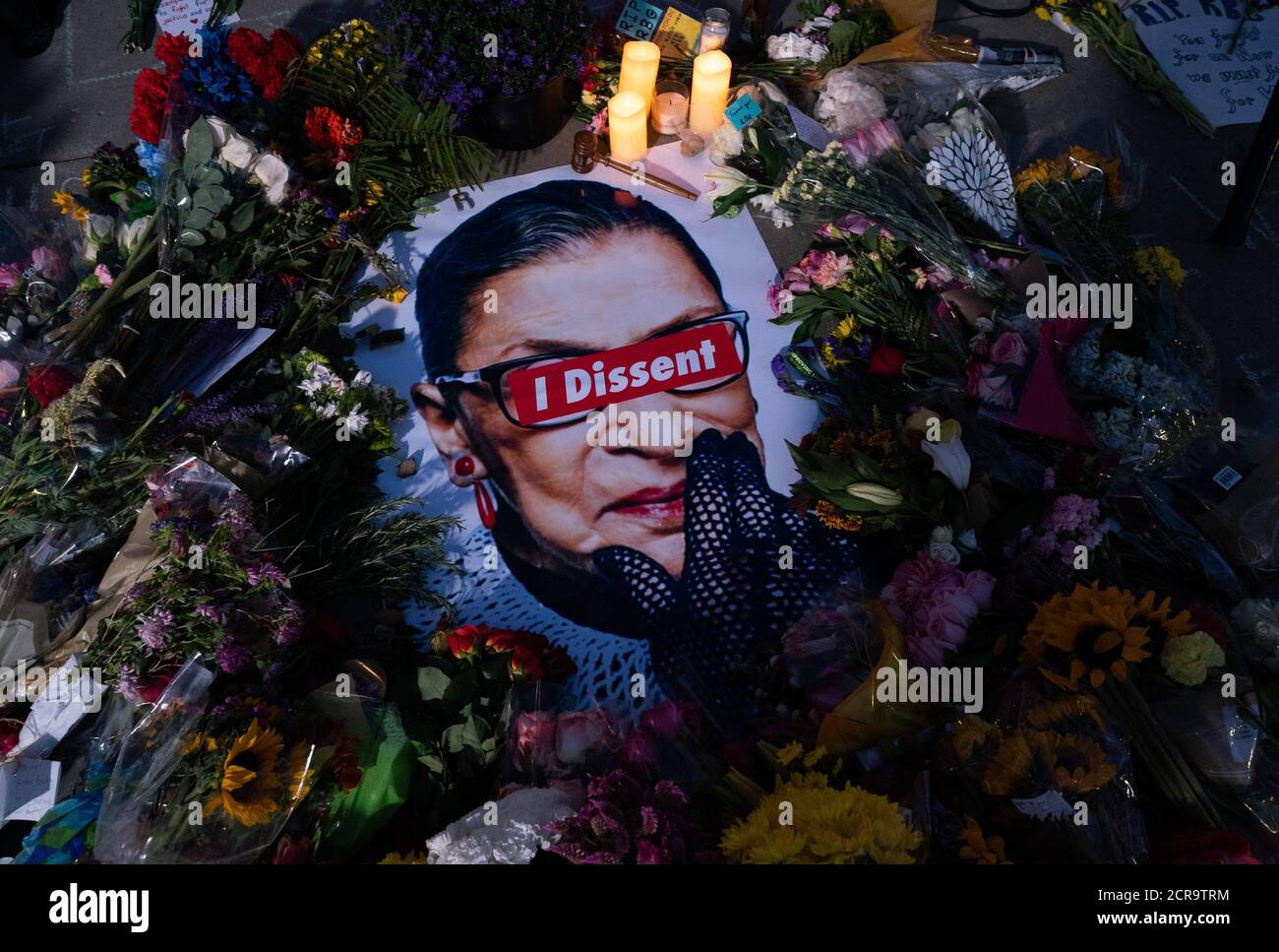 Washington, United States. 19th Sep, 2020. Flowers and a poster are seen outside of the Supreme Court as people pay their respects to the late Justice Ruth Bader Ginsburg at the United States Supreme Court in Washington, DC on Saturday, September 19, 2020. Ginsburg died yesterday at 87 after a battle with pancreatic cancer. Photo by Kevin Dietsch/UPI Credit: UPI/Alamy Live News Stock Photo