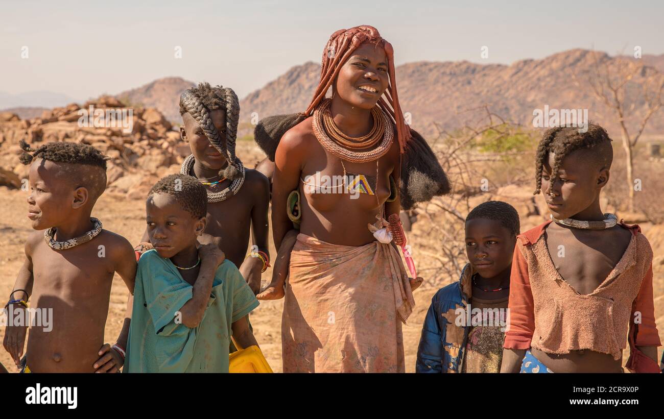 Himba family fetching water Stock Photo