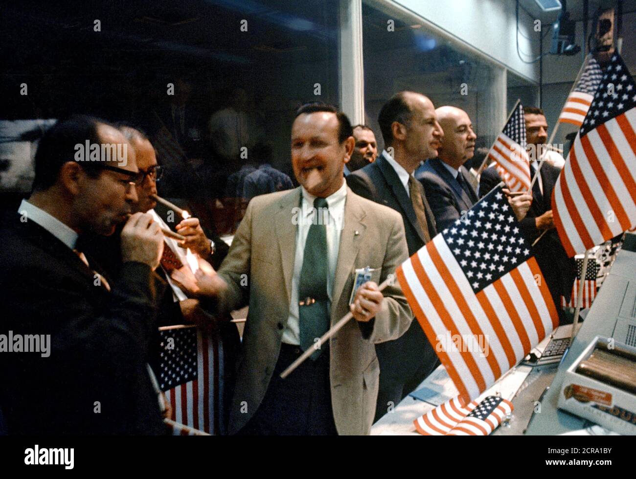 NASA and Manned Spacecraft Center officials join w flight controllers in the Mission Operations Control Room in celebrating the successful conclusion of the Apollo 11 lunar landing mission. Stock Photo
