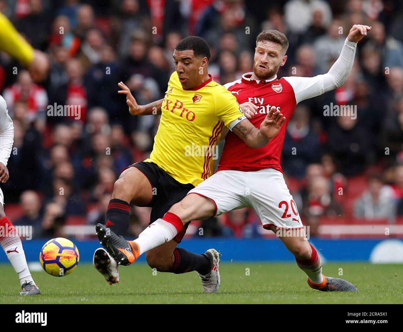 Soccer Football - Premier League - Arsenal vs Watford - Emirates Stadium, London, Britain - March 11, 2018   Watford's Troy Deeney in action with Arsenal's Shkodran Mustafi            REUTERS/Eddie Keogh    EDITORIAL USE ONLY. No use with unauthorized audio, video, data, fixture lists, club/league logos or "live" services. Online in-match use limited to 75 images, no video emulation. No use in betting, games or single club/league/player publications.  Please contact your account representative for further details. Stock Photo