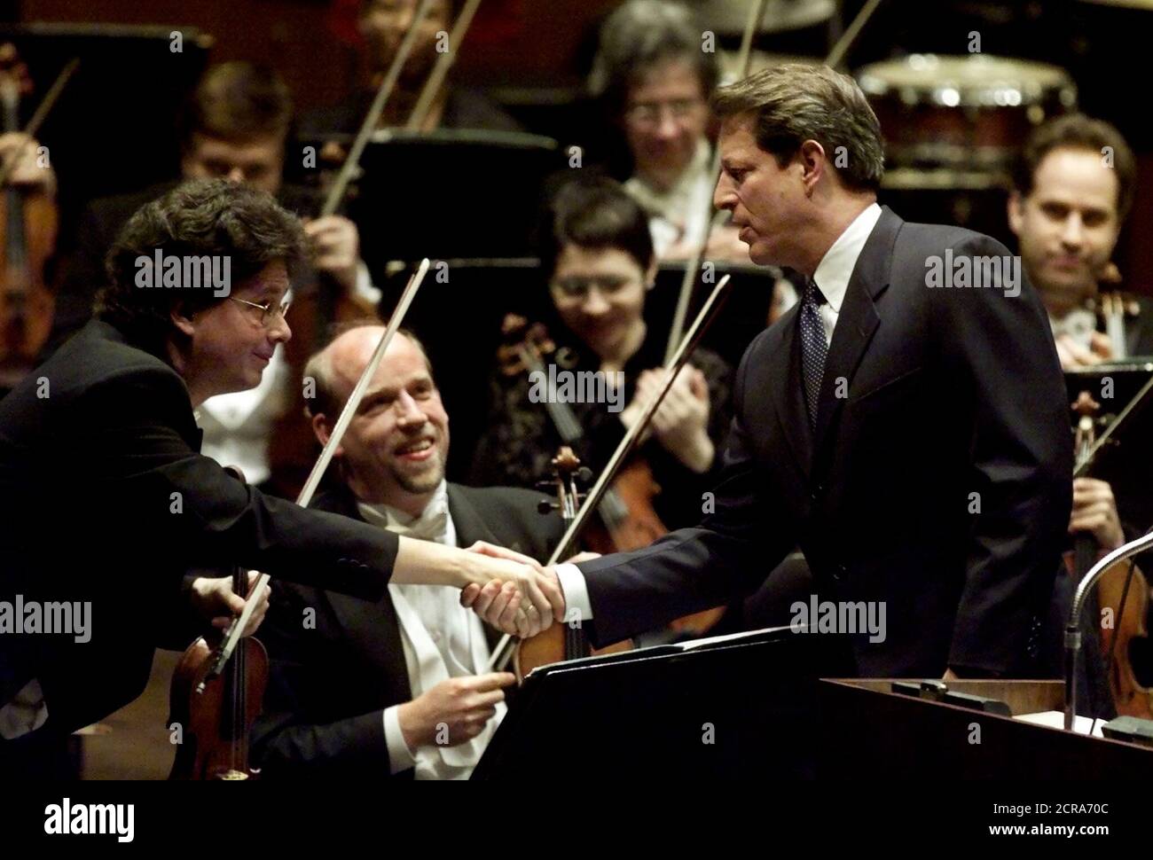 U.S. Democratic presidential hopeful Vice President Al Gore shakes hands with first violinist Richard Rood (L) of the American Symphony Orchestra after narrating Aaron Copeland's 'Lincoln Portrait' at Lincoln Center, February 7. Gore is on a two-day presidential campaign visit to New York City before heading to Florida and Michigan.  JRB/SV Stock Photo