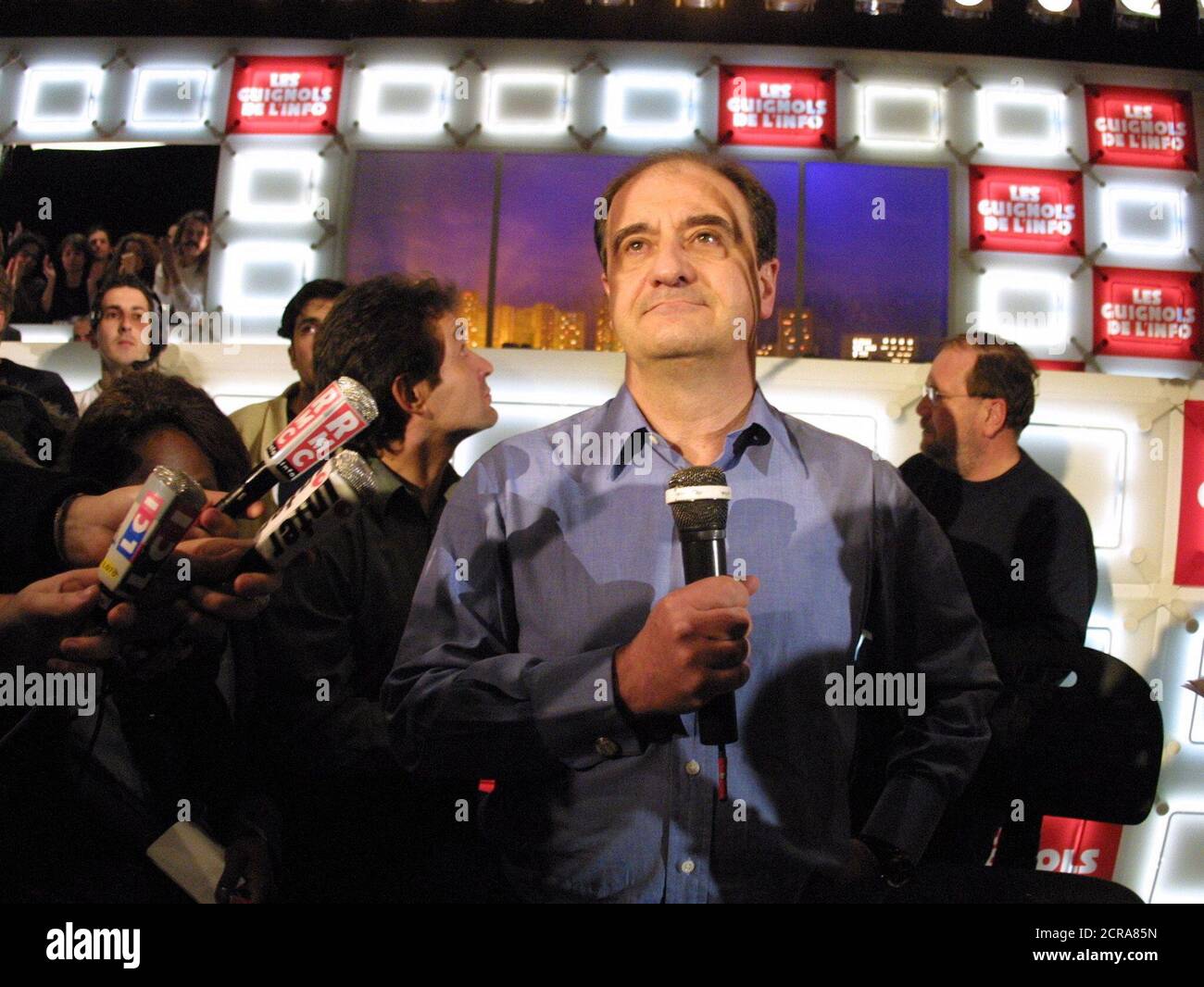 Pierre Lescure (C) speaks to staff after being sacked at the French pay-TV station Canal Plus in Paris, April 16, 2002. Earlier Jean-Marie Messier, the CEO of Vivendi Universal and owner of Vivendi's Canal Plus pay TV unit, announced that top executive Lescure had resigned his post and would be replaced by TF1 television group senior executive Xavier Couture. Union representative at Canal Plus denounced the dumping of popular station chief Lescure. REUTERS/Mousse  JES Stock Photo