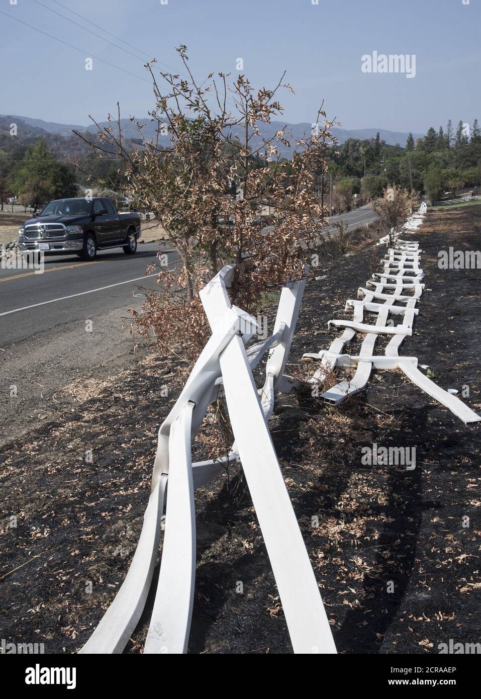 Vacaville, United States. 19th Sep, 2020. Melted vinyl ranch fence lies along Pleasants Valley Road in Vacaville, California on Saturday, September 19, 2020. Over 19,000 firefighters continue to battle 27 major wildfires in California as over 3.5 million acres have burned with no end in sight. Photo by Terry Schmitt/'UPI Credit: UPI/Alamy Live News Stock Photo